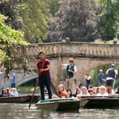 Tourists take rides in punts on the River Cam in Cambridge as temperatures could hit 30°C in parts of the UK next week after heavy rain drenches the country.