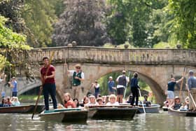 Tourists take rides in punts on the River Cam in Cambridge as temperatures could hit 30°C in parts of the UK next week after heavy rain drenches the country.