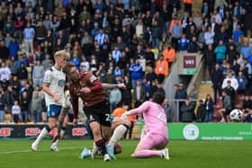 Bradford City's Bobby Pointon claims a touch to make it 3-0 for the Bantams against Huddersfield Town. The goal was officially given to Josh Neufville, but the EFL dubious goals panel is set to check it, with boss Graham Alexander claiming video evidence shows that Pointon scored. Picture: Jonathan Gawthorpe