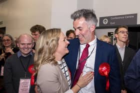 Labour candidate David Skaith celebrates his victory with wife Alice and his team as returning officer Richard Flinton announces the results of the count. Picture: Ernesto Rogata