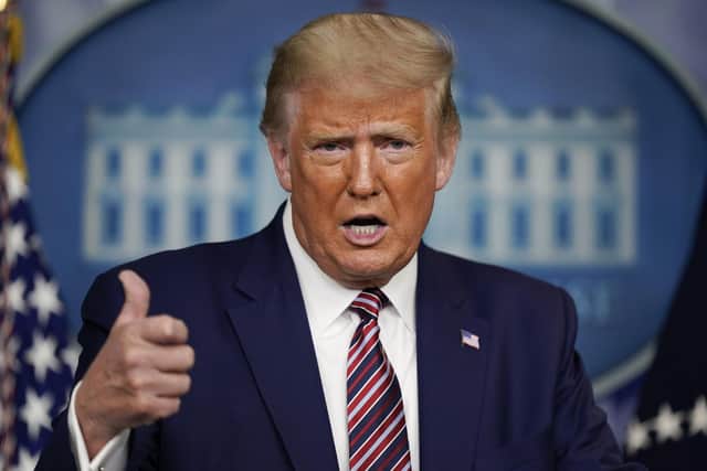 President Donald Trump gestures while speaking during a news conference at the White House, Sunday, Sept. 27, 2020, in Washington. (AP Photo/Carolyn Kaster)