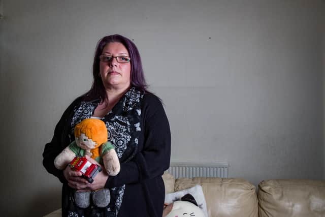Sharon Lord, 47, a Benefits Assessor from Burnley, holding toys belonging to her children, as she is worrired bailiffs will come and take everything in her home. She is one of around 1,400 people saddled with huge unexpected payments after SSB Law stopped trading in January, with debts of millions.Hundreds of householders face losing their homes after signing up to a controversial 'no win no fee' legal firm which has collapsed owing £48m.Around 1,500 residents were offered free legal representation by SSB Law, which said it would help them win compensation for dodgy cavity wall insulation.However, the Sheffield-based firm fell into administration in January leaving them liable for huge court fees.The firm also faces a probe by legal and financial watchdogs.