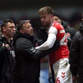 Fleetwood Town's Shaun Rooney (centre) reacts as he leaves the pitch after being shown a red card during the Sky Bet League One match at Highbury Stadium, Fleetwood. Picture: Barrington Coombs/PA