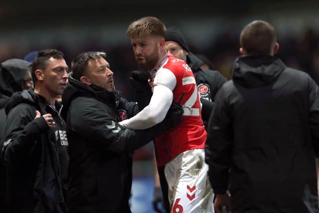 Fleetwood Town's Shaun Rooney (centre) reacts as he leaves the pitch after being shown a red card during the Sky Bet League One match at Highbury Stadium, Fleetwood. Picture: Barrington Coombs/PA