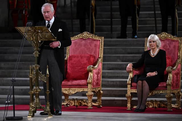 King Charles III gives his address thanking the members of the House of Lords and the House of Commons for their condolences, at Westminster Hall, London, as the Queen Consort looks on, following the death of Queen Elizabeth II.