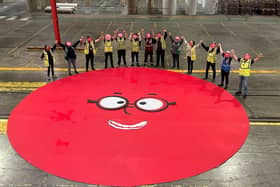 CorrBoard colleagues with the finished giant red nose