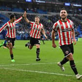 On the mark: Sheffield United’s George Baldock celebrates scoring the winning goal at Cardiff City on Saturday. (Picture: Simon Galloway/PA Wire