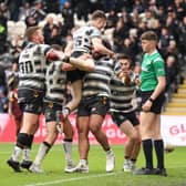Chris Satae is mobbed by Hull FC team-mates after scoring a second-half try. (Photo: John Clifton/SWpix.com)