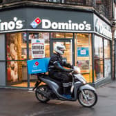 Domino’s Pizza has revealed slower sales growth for the latest quarter despite boosts from new ranges of thinner pizzas and fried chicken.(Photo by Domino's/PA Wire)