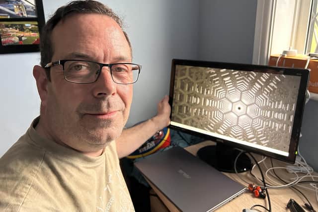 Thrifty dad Darren Leeming, 54, with a monitor he picked up from Facebook Marketplace.