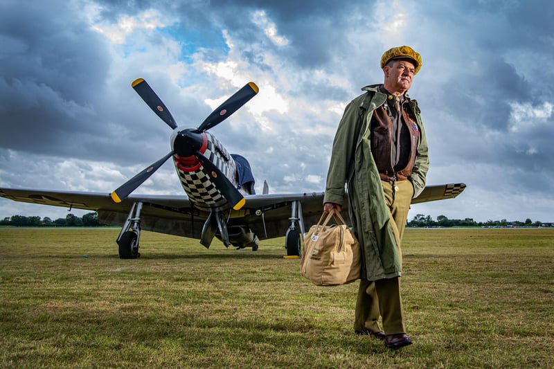 Patriceo Piras with a P-51 Mustang  at the Flying Legends event photographed for the Yorkshire Post by Tony Johnson at the ex RAF airfield at Church Fenton in North Yorkshire. 
Once home to the very first “Eagle Squadron” of American pilots flying Brewster Buffalos before converting onto Mk1 Hawker Hurricanes and where once the Gloster Gladiator reigned supreme. 15th July 2023