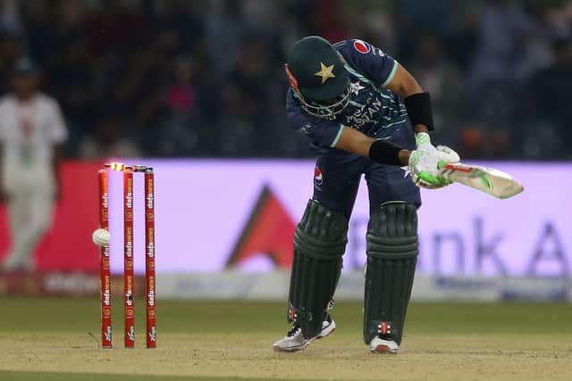 Pakistan's Mohammad Rizwan is bowled out by England's Reece Topley during the seventh twenty20 cricket match between Pakistan and England, in Lahore. (AP Photo/K.M. Chaudary)