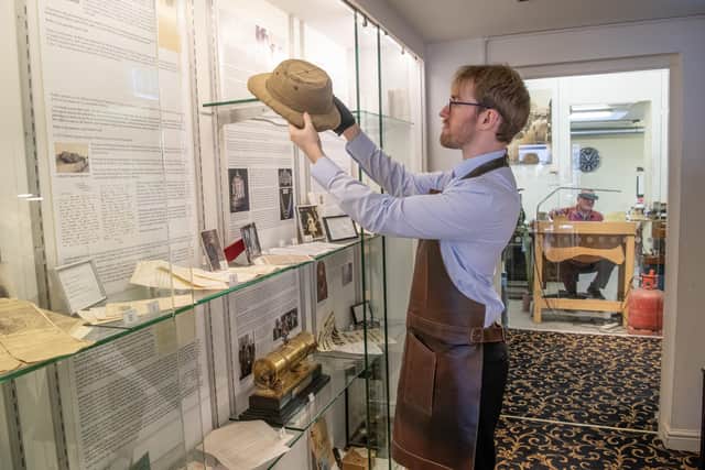 Liam O'Neill displays Ogden's helmet at the Tutankhamun exhibition at JR Ogden Jewellers in Harrogate. Photographed for the Yorkshire Post by Tony Johnson.