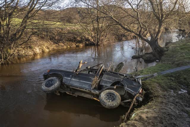 The 4×4 was recovered from the river and three men found inside had died. Photo credit should read: Danny Lawson/PA Wire