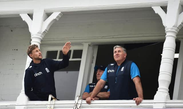 England captain Joe Root and coach Chris Silverwood look on as rain delays play during day five of the First Test Match between England and India at Trent Bridge on August 08, 2021 in Nottingham, England. (Photo by Nathan Stirk/Getty Images)