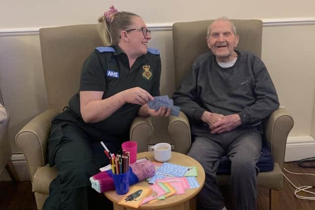 Student paramedic Susie Lammiman with Aden View Care Home resident James Gill.