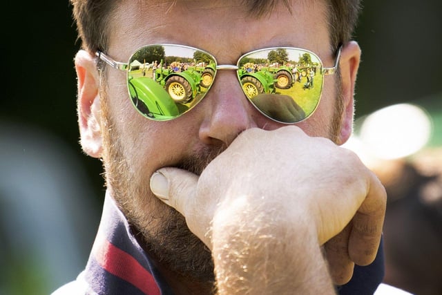 Tractors are reflected in a spectators glasses.Picture taken by Yorkshire Post Photographer Simon Hulme 10th June 2023