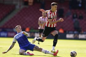 FRUSTRATIONS: Anel Ahmedhodzic of Sheffield United is tackled by James McClean of Wigan Athletic