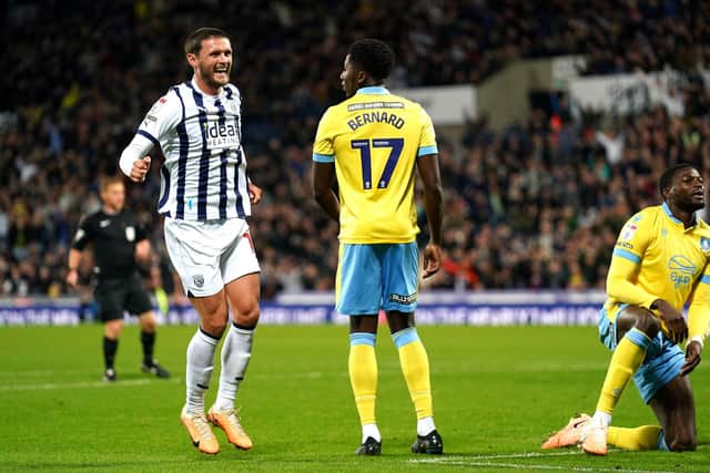 West Bromwich Albion's John Swift (left) celebrates scoring their side's first goal of the game as Sheffield Wednesday's Di'Shon Bernard looks on (Picture: PA)