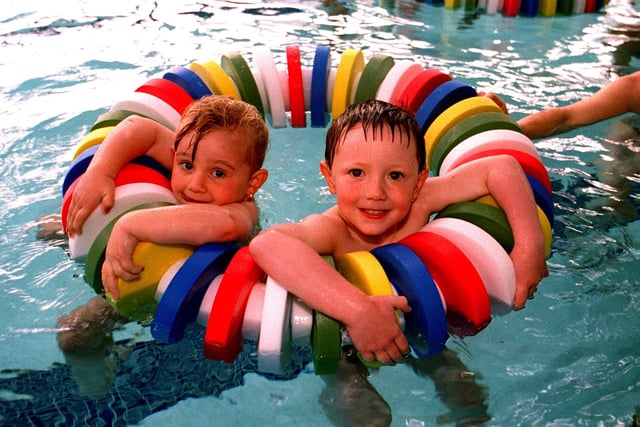 Kasey Crossland, aged 3, and James Woods, 4, try out the new rings at Ponds Forge in 1996
