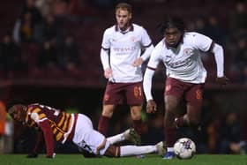 LIMITED OPPORTUNITIES: Chisom Afoka (left) playing for Bradford City against Manchester City Under-21s in the Football League Trophy
