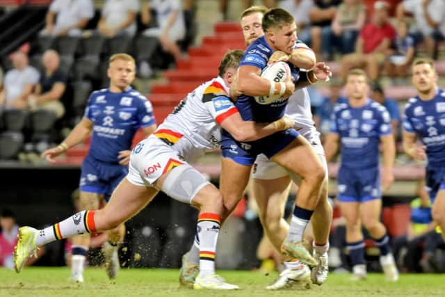 Toulouse's Joe Cator is tackled by Bradford Bulls players (Picture: David Gibson/SWpix.com)
