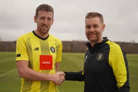 New Harrogate Town signing Tom Eastman (left) is greeted by manager Simon Weaver (right). Picture courtesy of Harrogate Town AFC.