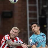 AERIAL THREAT: Burnley were unable to contain Oli McBurnie, pictured jumping for a header against Jack Cork, son of former Sheffield United striker Alan
