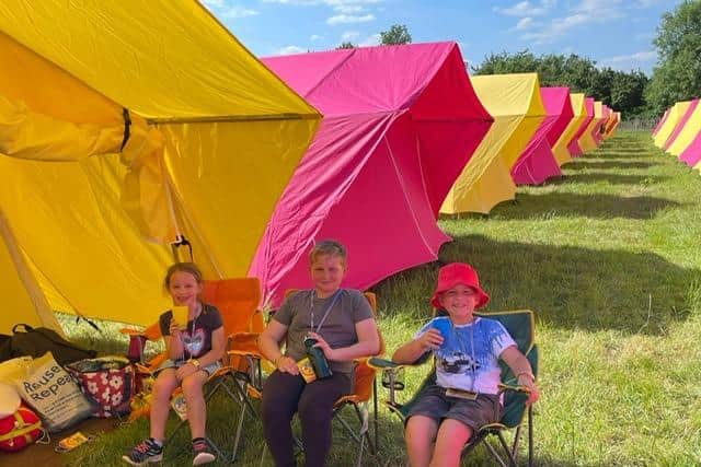 Chris Fawcett's grandchildren camping in one of his tents at Glastonbury