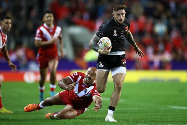 Kyle Evans runs away to score against Tonga. (Photo by Michael Steele/Getty Images)