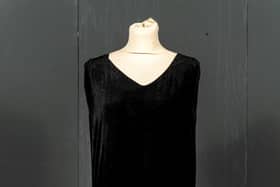 Lot 2055: Circa 1920s Black Velvet Sleeveless Evening Dress, with two tier skirt with scalloped hems, appliquéd with floral bead decoration in grey and amber, and a black silk under dress. Sold with black silk opera cape. Estimate: £300-500 plus buyer’s premium, at Tennants Auctioneers.