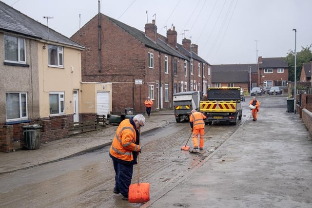 The clean up begins in Catcliffe near Rotherham, South Yorkshire, in the aftermath of Storm Babet.