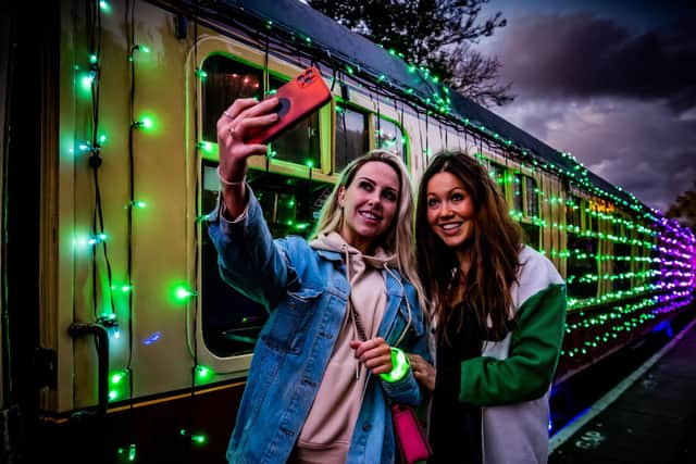 Picture James Hardisty.
The North Yorkshire Moors Railway - Light Spectacular Express, covered with thousands of colouful lights. Pictured (left to right) Jordan Wake, with Sophie Mei Lan, taking a quick selfie before boarding the train  at Pickering Station.
