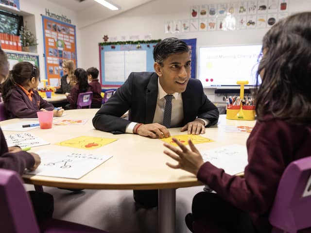 Prime Minister Rishi Sunak speaks to pupils in a year one maths class during a visit to the Wren Academy school in Finchley, north London. PIC: Richard Pohle/The Times /PA Wire