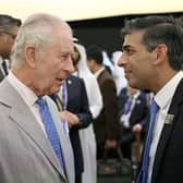 King Charles III speaks with Prime Minister Rishi Sunak as they attend the opening ceremony of the World Climate Action Summit at Cop28 in Dubai. PIC: Chris Jackson/PA Wire
