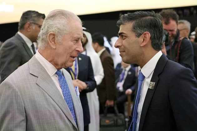King Charles III speaks with Prime Minister Rishi Sunak as they attend the opening ceremony of the World Climate Action Summit at Cop28 in Dubai. PIC: Chris Jackson/PA Wire