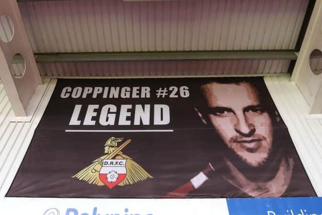REVERED: Signs of the affection Doncaster Rovers fans have for James Coppinger are all around the Eco Power Stadium - even though he would prefer it if they were not