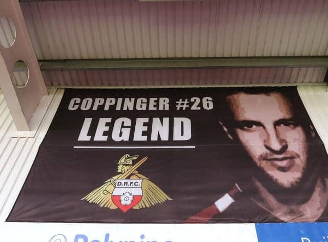 REVERED: Signs of the affection Doncaster Rovers fans have for James Coppinger are all around the Eco Power Stadium - even though he would prefer it if they were not