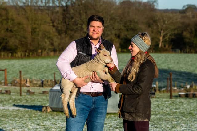 Farmers Adam and Kelly Robinson, of Lower Coates Farm, Blackergreen Lane, Silkstone Common, South Yorkshire, with one of their their pedigree Charollais lambs.