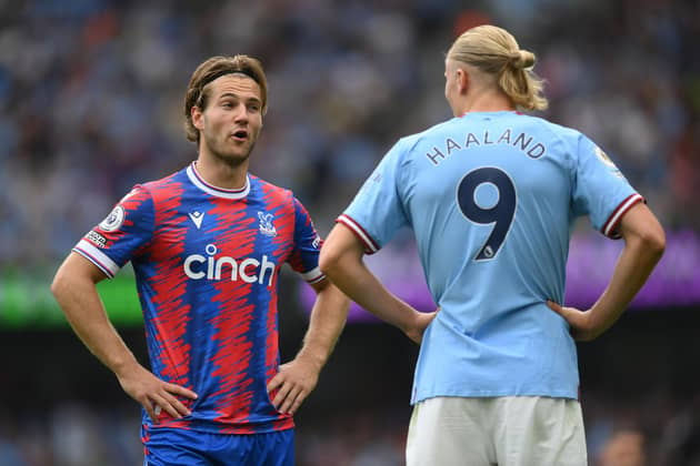 MANCHESTER, ENGLAND - AUGUST 27:  Joachim Andersen of Crystal Palace talks with Erling Haaland of Manchester City during the Premier League match between Manchester City and Crystal Palace at Etihad Stadium on August 27, 2022 in Manchester, England. (Photo by Shaun Botterill/Getty Images)