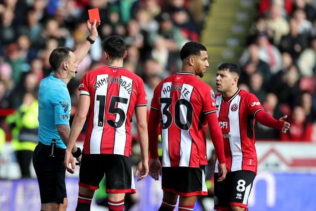 RED CARD: Sheffield United's Mason Holgate is sent off against Brighton and Hove Albion