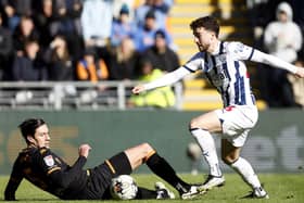 SITTER: Hull City's Alfie Jones (left) goes to ground when up against West Bromwich Albion's Mikey Johnston
