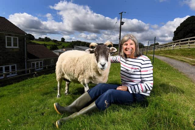 Wendy Underwood pictured with Mary the sheep at Stang End Farm, Danby