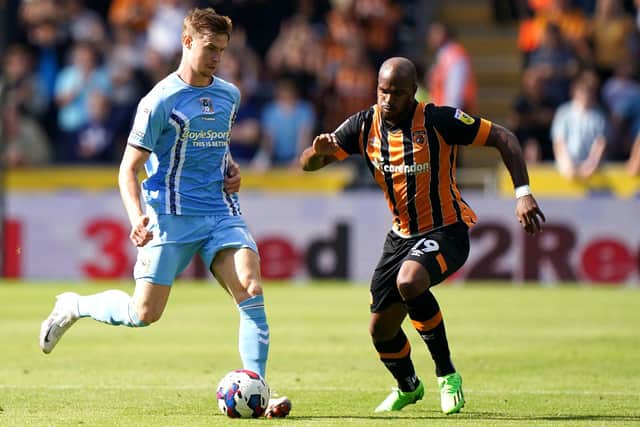 YOU'RE IN: Hull City's Oscar Estupinan battles for the ball against Coventry City's Ben Sheaf (left) at the MKM Stadium at the weekend. Picture: Tim Goode/PA