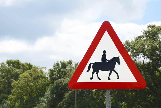 Road sign warns of horse riders in rural areas.