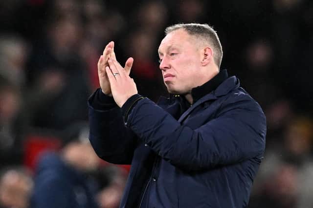 Nottingham Forest's Welsh manager Steve Cooper applauds the fans following the English League Cup semi-final second-leg  football match between Manchester United and Nottingham Forest at Old Trafford in Manchester, north west England, on February 1, 2023. (Photo by PAUL ELLIS/AFP via Getty Images)