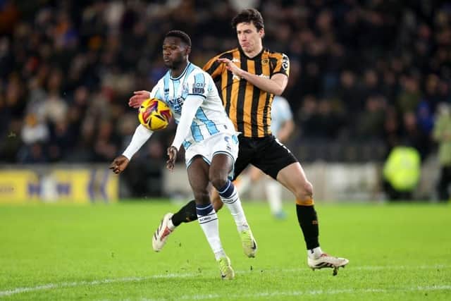 Middlesbrough's Emmanuel Latte Lath controls the ball whilst under pressure from Hull City defender Alfie Jones during the Sky Bet Championship match at the MKM Stadium on January 1. Photo by George Wood/Getty Images.