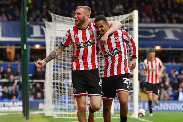 Sheffield United have already lost Iliman Ndiaye, right, they do not want to lsoe Oli McBurnie, left, pictured celebrating one of his 13 goals last season at Birmingham (Picture: Matthew Lewis/Getty Images)