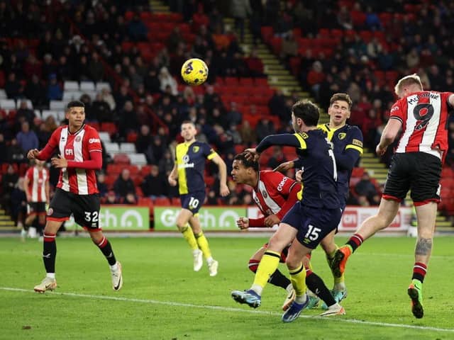 CONSOLATION: Oli McBurnie heads Sheffield United's goal in their 3-1 defeat to Bournemouth