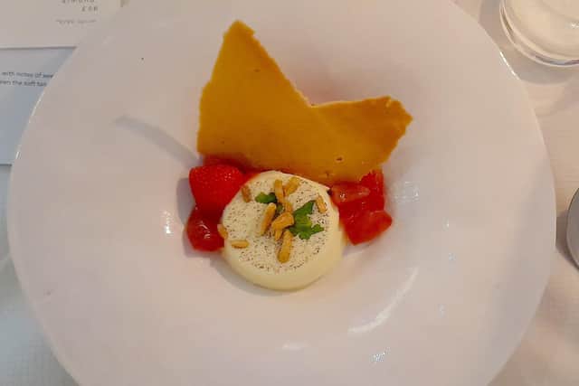 Madagascar vanilla panna cotta, strawberry gel sorbet and tuile at Kitchen 91